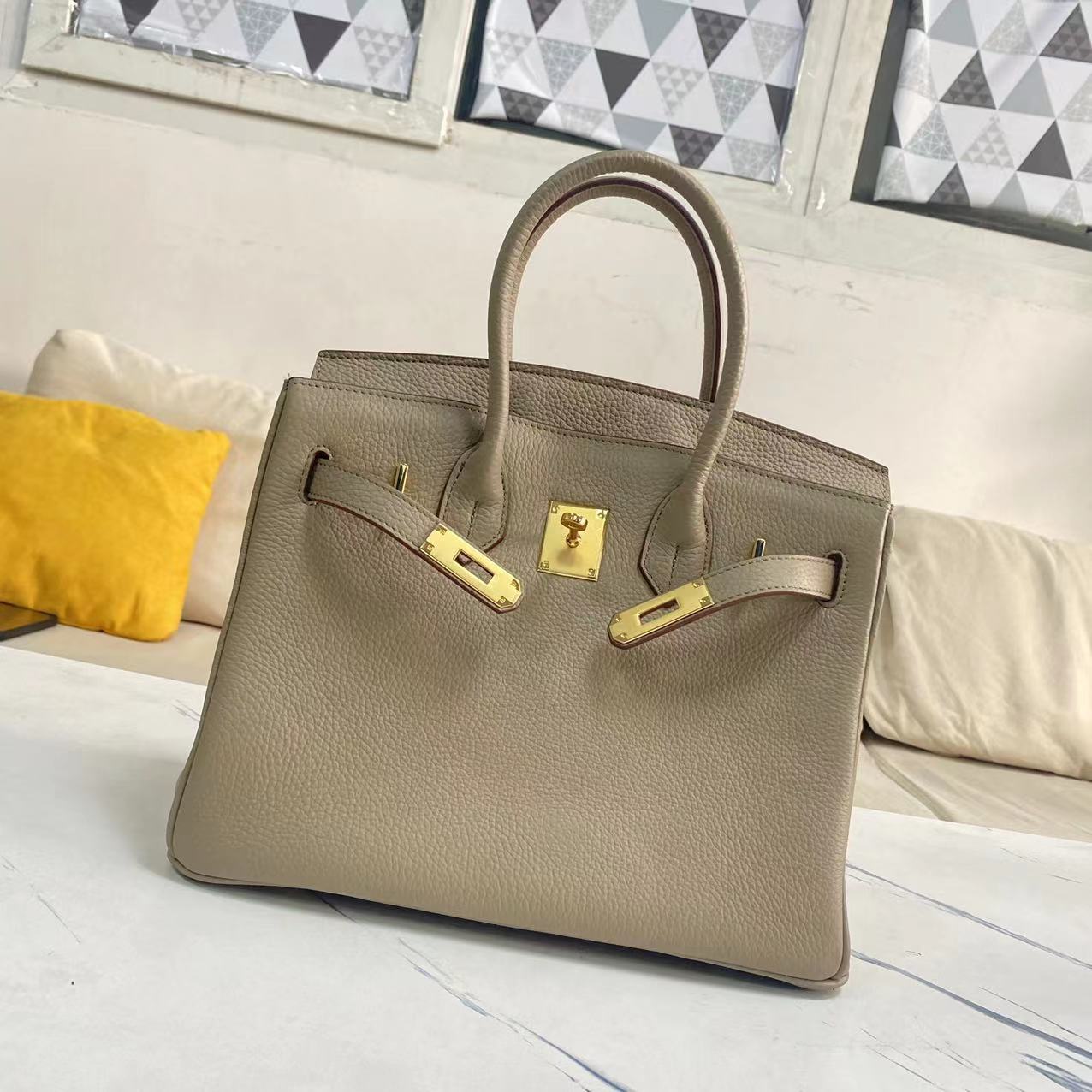 Women's Litchi Grain Cowhide First Layer Kelly Handbags