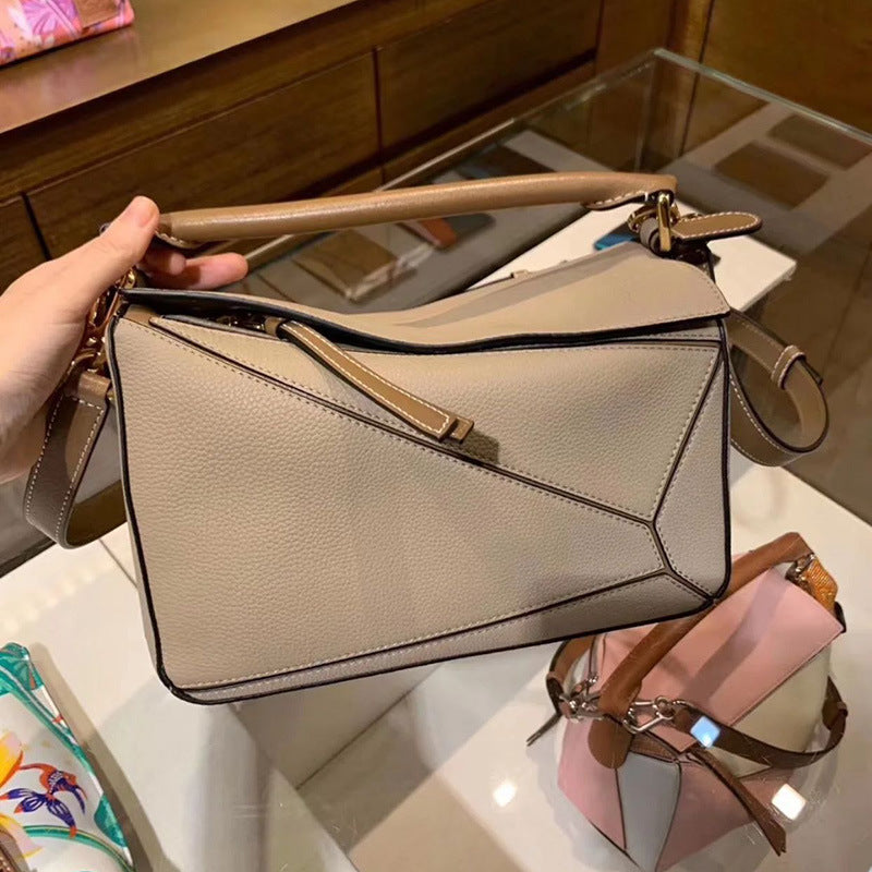 Women's Tide Xi Geometric Stitching Leather Portable Handbags