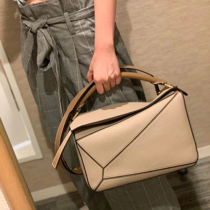 Women's Tide Xi Geometric Stitching Leather Portable Handbags