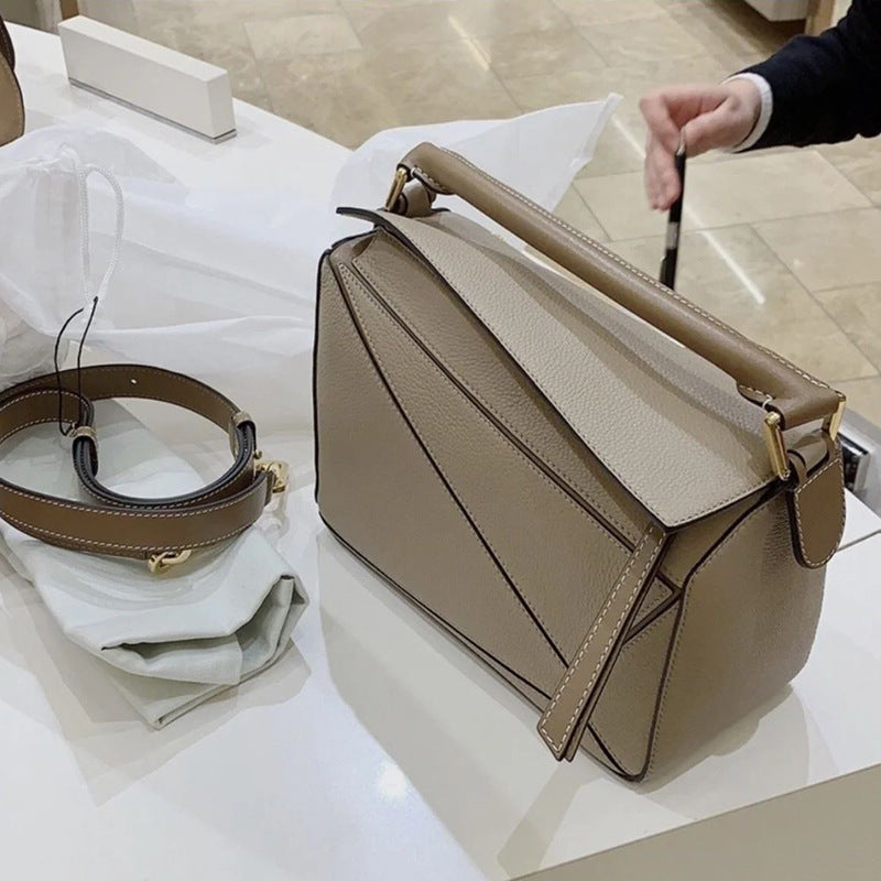 Women's Tide Xi Geometric Stitching Leather Portable Handbags