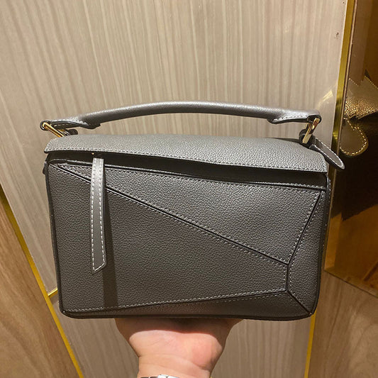Women's Tide Xi Geometric Stitching Leather Portable Handbags