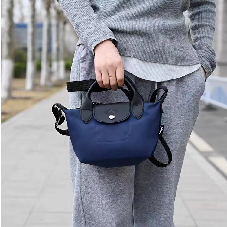 Medium Mini Dumpling Punch Nylon Change Crossbody Bags