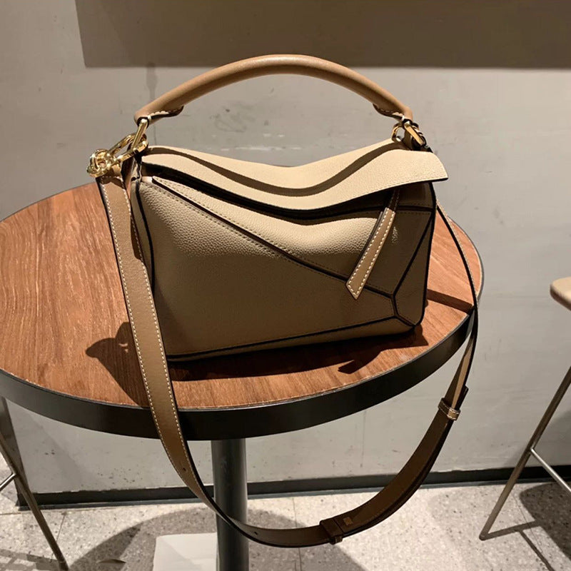 Women's Tide Xi Geometric Stitching Leather Portable Handbags