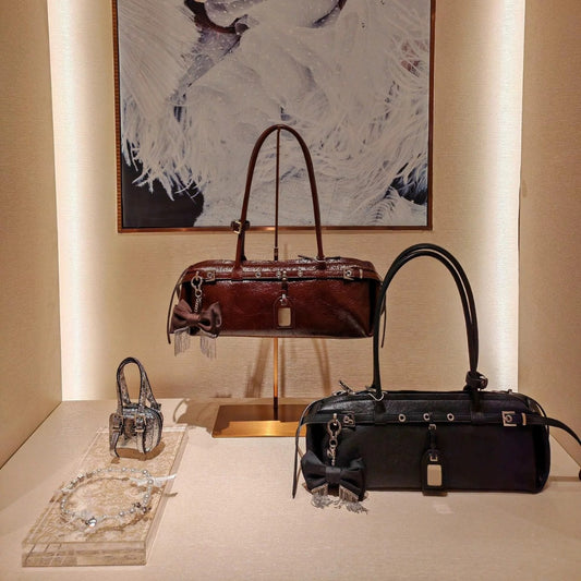 Women's High-grade Retro Minority Genuine Leather Sausage Portable Crossbody Bags