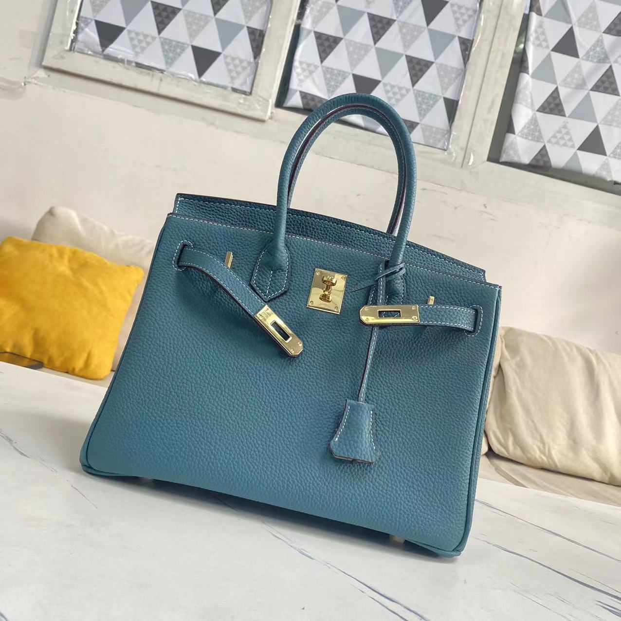 Women's Litchi Grain Cowhide First Layer Kelly Handbags