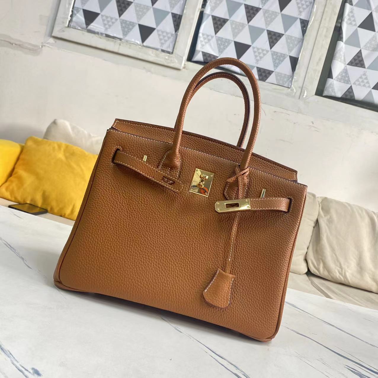 Women's Litchi Grain Cowhide First Layer Kelly Handbags