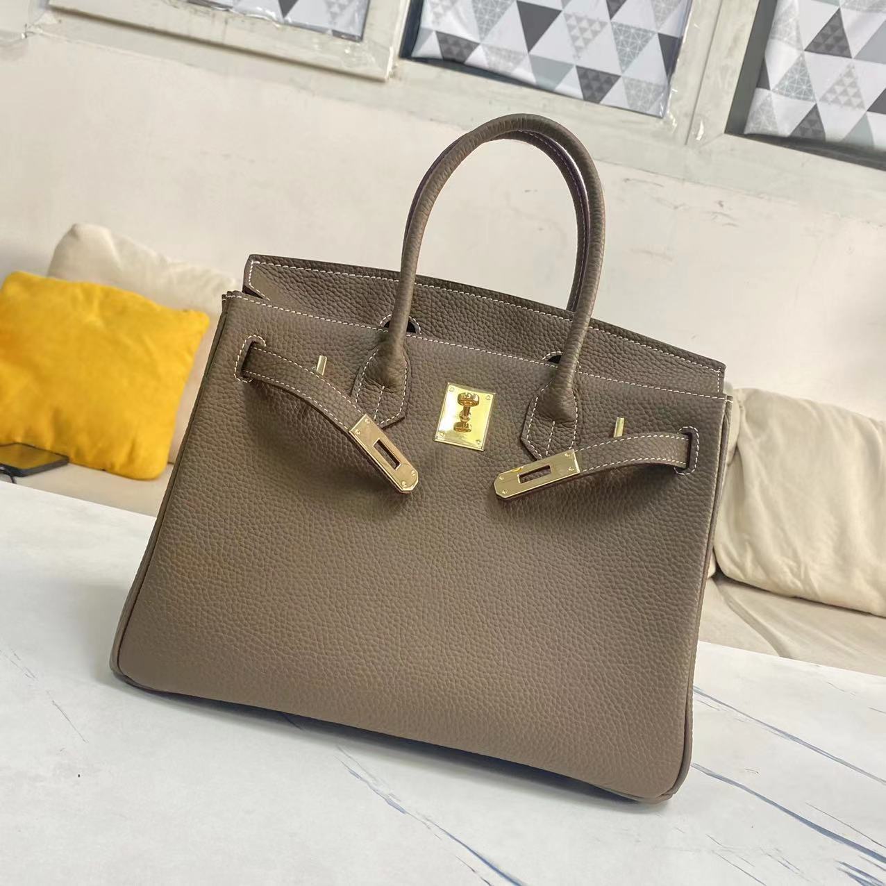 Women's Litchi Grain Cowhide First Layer Kelly Handbags